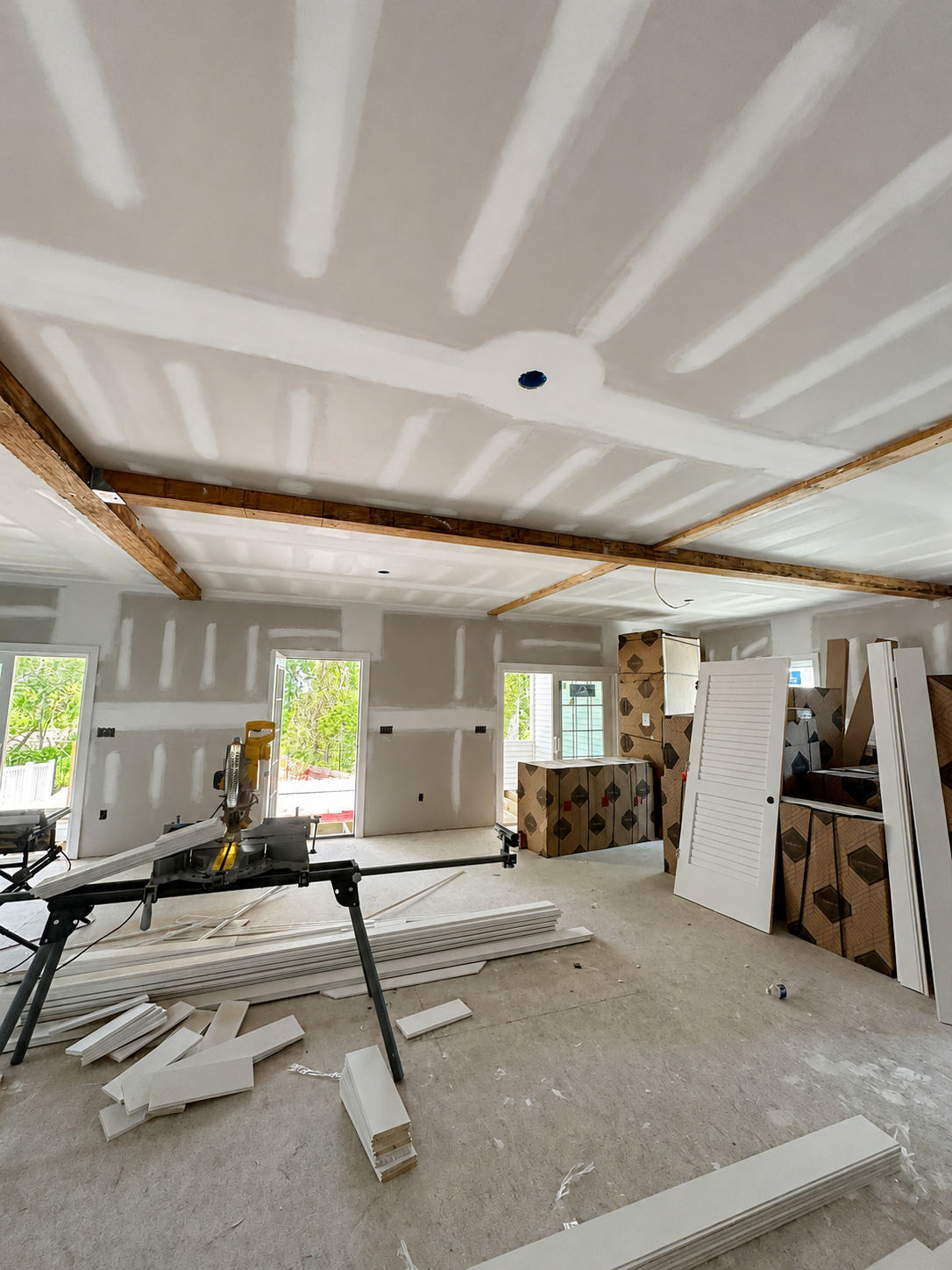 Great room during ceiling and wall finish construction