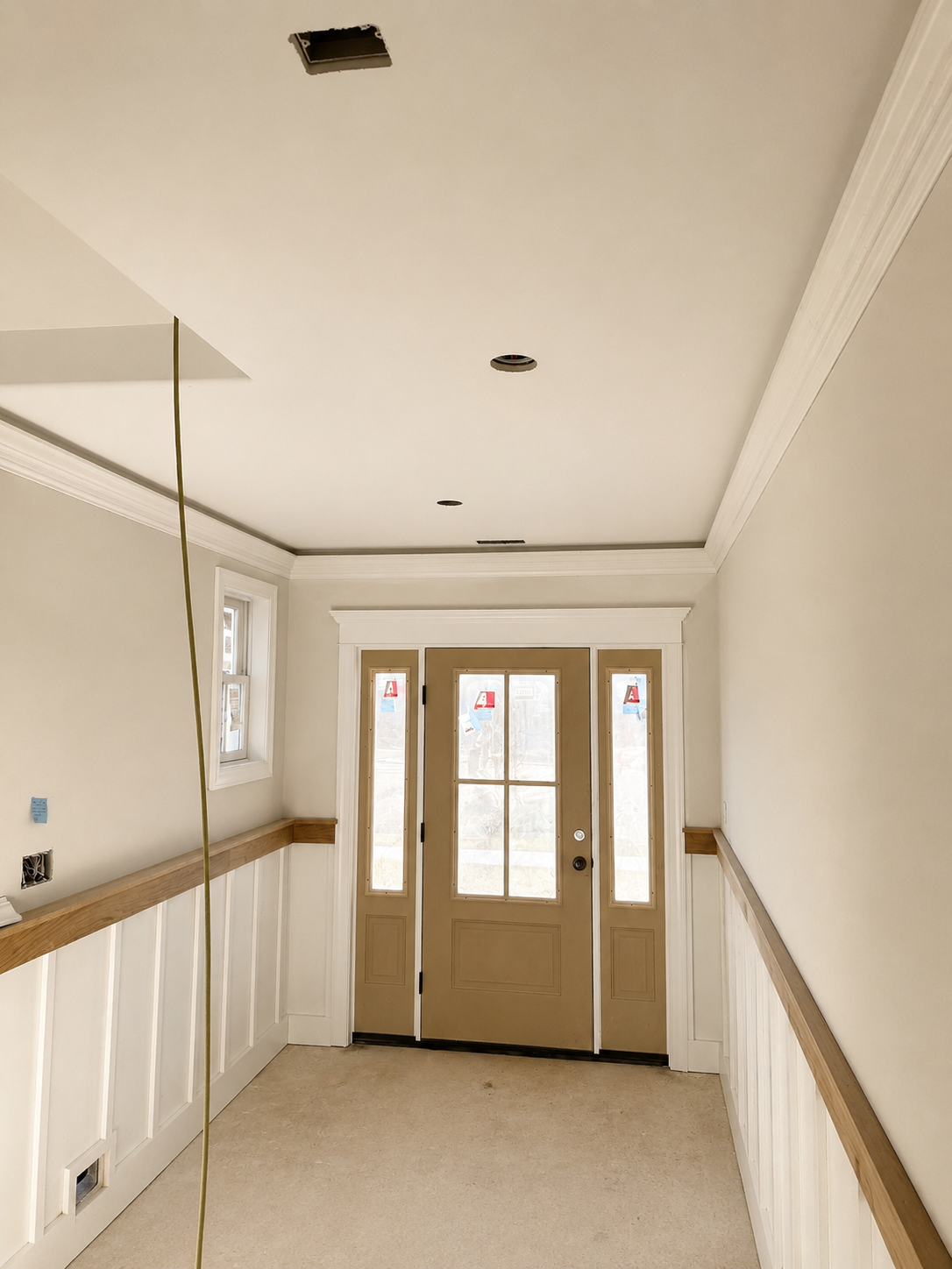 Foyer trim work before the completed entryway finish
