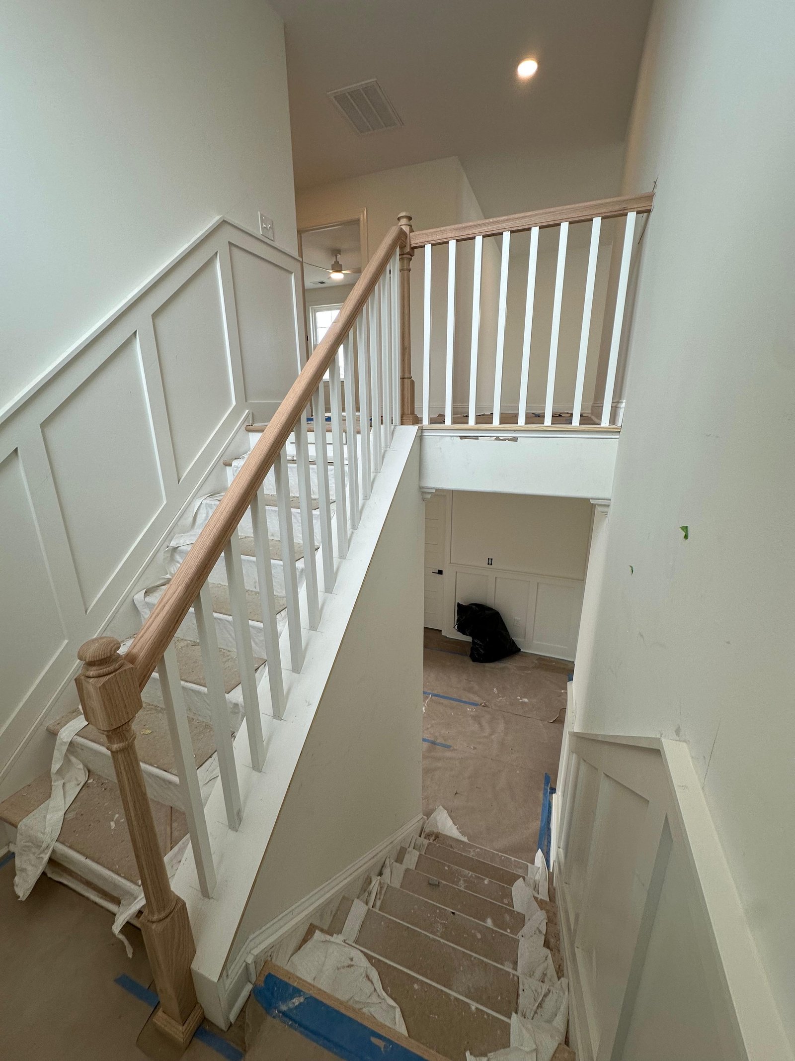 Finished stair railing and trim with clean custom detailing
