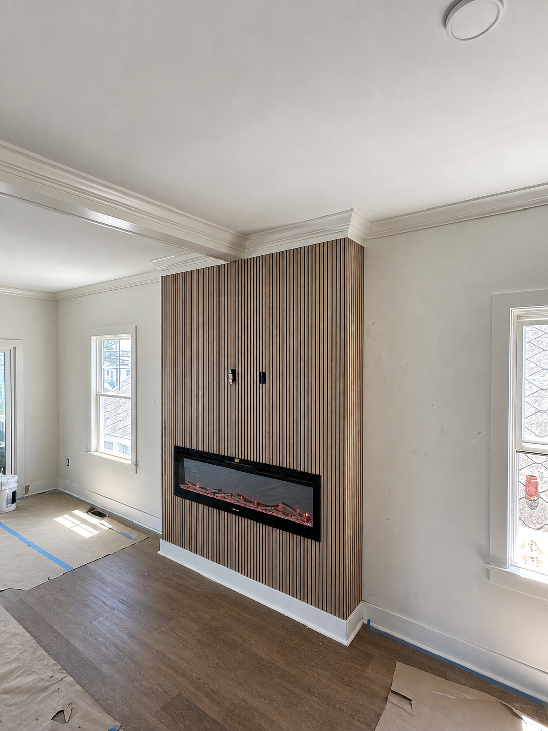 Finished fireplace feature wall with vertical wood slats