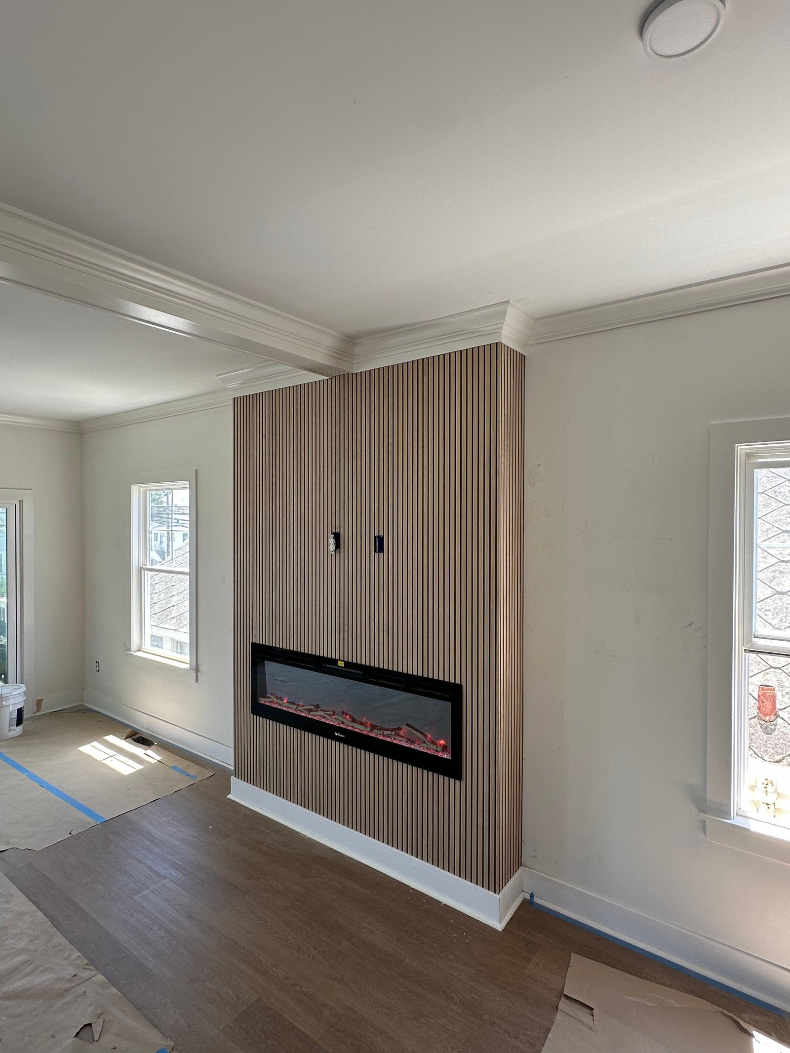 Finished fireplace feature wall with vertical wood slats